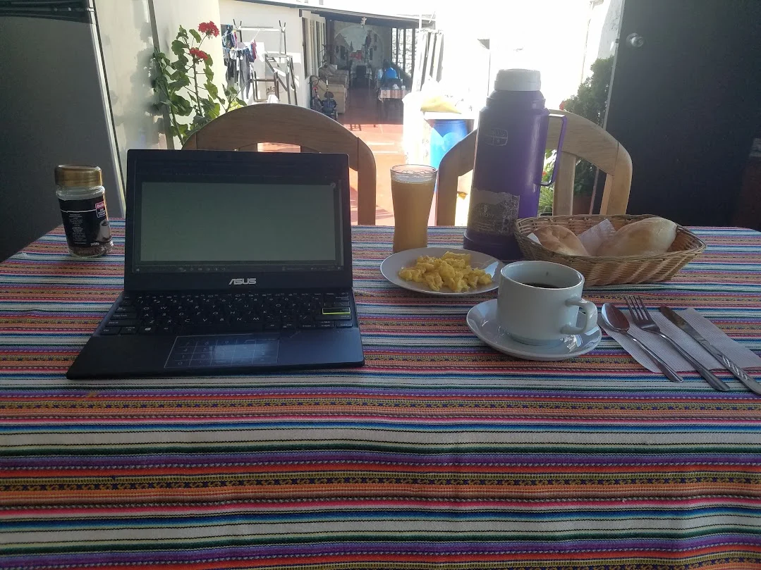 Minimalist laptop setup overlooking a mountain view