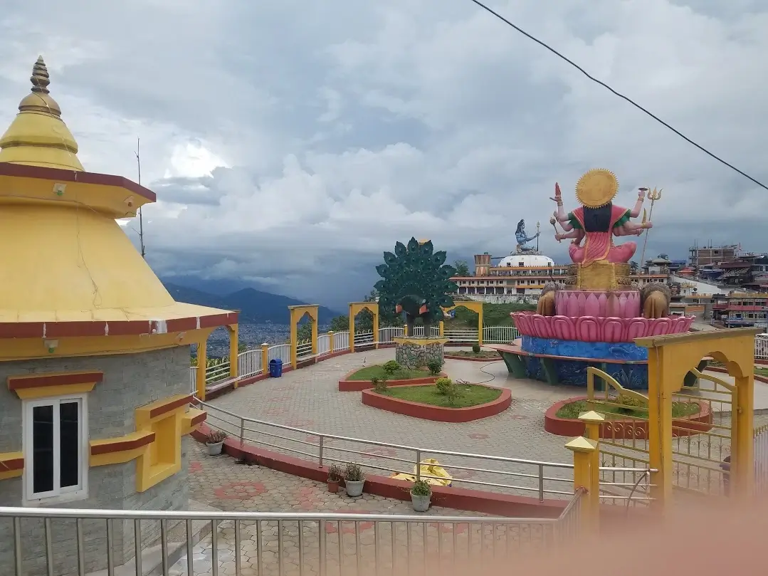 big buddhist statue near pagoda